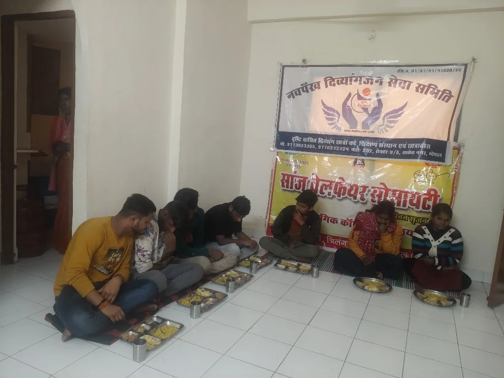 Youth sharing a community meal supported by SAANJ